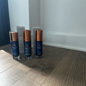 Empty Augustinus Bader bottles